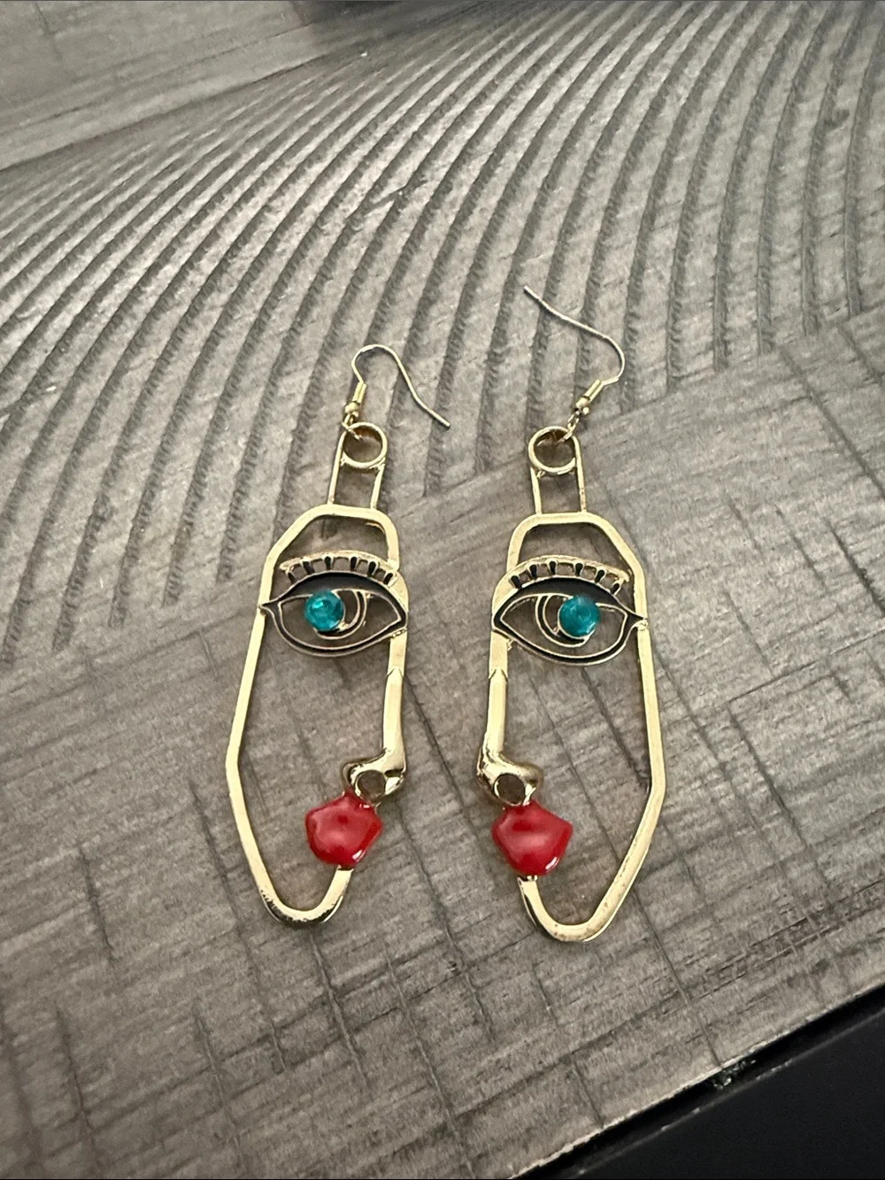 Gold Face Outline Drop Earrings with Blue and Red Accents